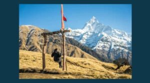 Rugged grassy mountain with everest snow capped in background